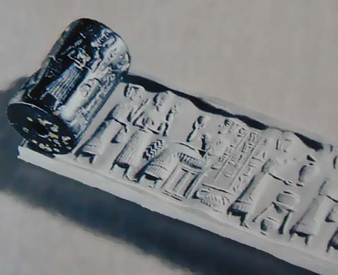 5c - ancient seal of unidentified female, semi-divine mixed-breed king, & patron goddess Ningal; seal rolled onto wet caly & fired hot to harden so as to last thousands of years